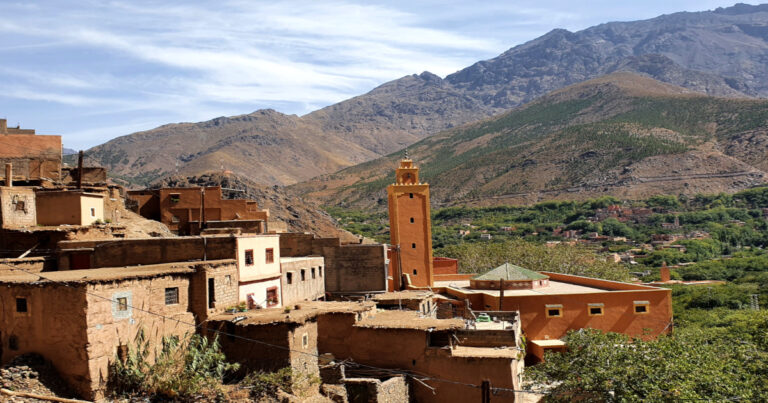 Explore the High Atlas Mountains: A traditional village nestled amidst breathtaking Moroccan scenery